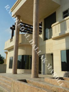 granite 7.3 meters  and onyx bookmatcth curved segmented column at khawaneej – dubai