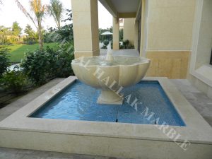 khawaneej villa water fall and garden fountain desert beig stone with mosaics