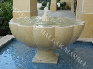 khawaneej villa water fall and garden fountain desert beig stone with mosaics