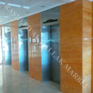 Orange Travertine wall cladding and creama marfil flooring with waterjet medalion for building entrance  – Dubai