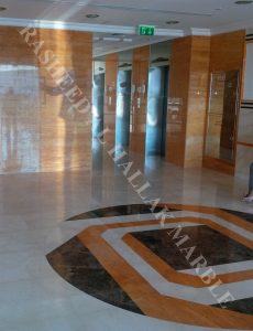 Orange Travertine wall cladding and creama marfil flooring with waterjet medalion for building entrance  – Dubai