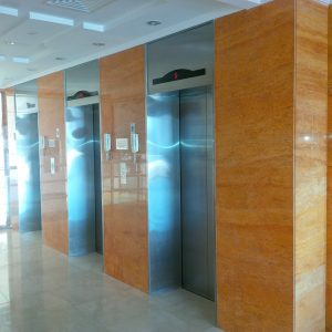 Wall Cladding & Flooring IN ORANGE TRAVERTINE AND ROYALCREAMA  MARBLE